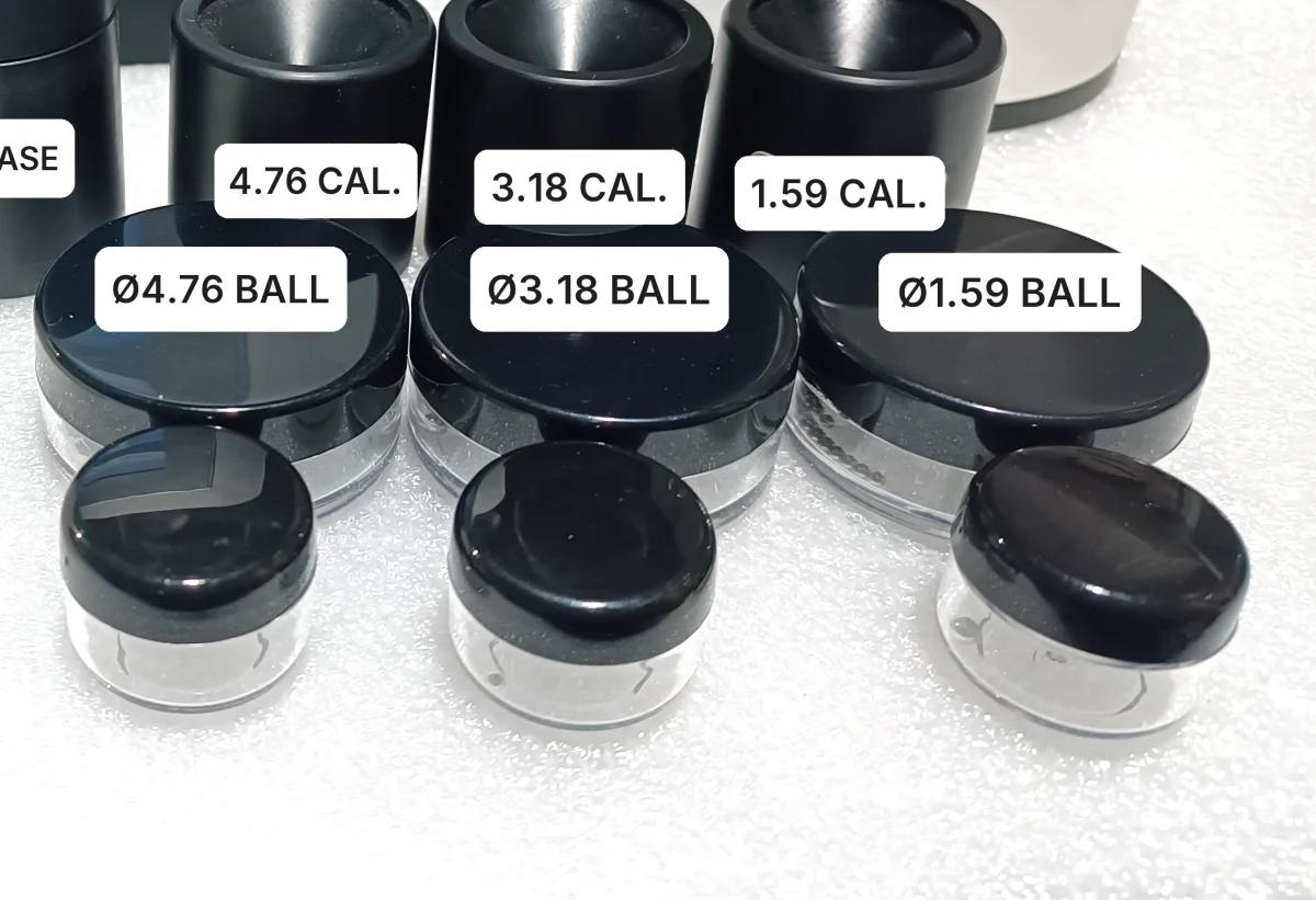 Three sizes of steel target ball for the KHT MTG-100 with their calibration fixtures